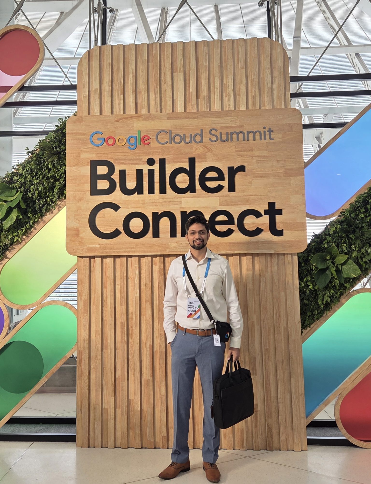 Rohan Sharma at Google Cloud Summit: Builder Connect India 2026, standing beneath the wooden Builder Connect signage at Yashobhoomi, Delhi.